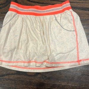 Cream and colorful dots with neon sparkly orange waist band. Skort.